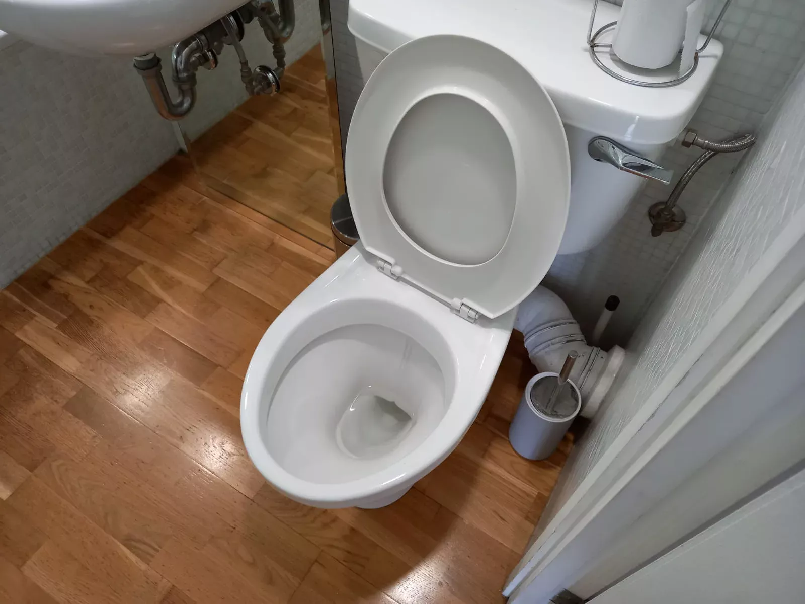 Toilet and bathroom floor cleaned by K’s Elite Cleaning